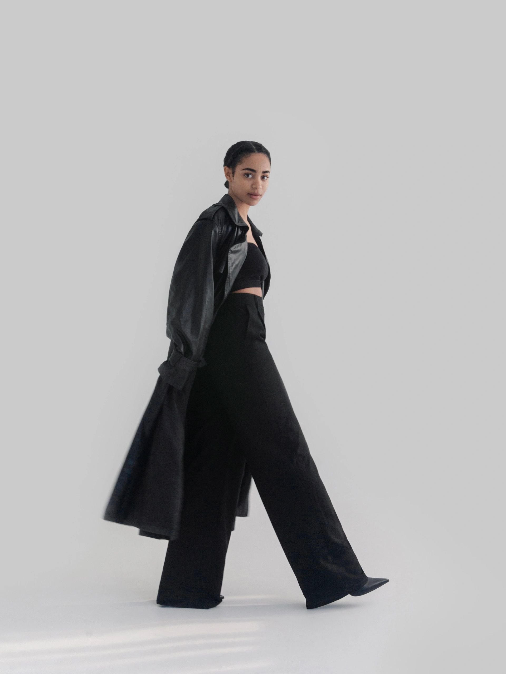 Fashion model in a black leather-inspired outfit